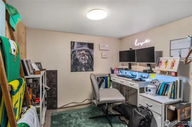 Lower level utility room with Hot Water Heater currently being used as an additional office space