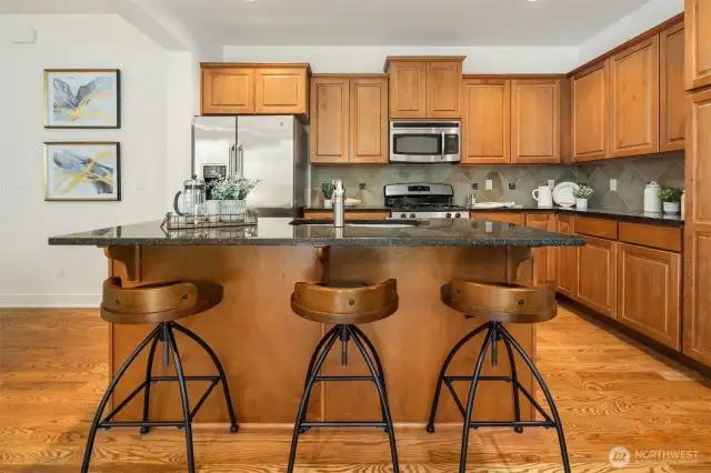Oversized island offering bar seating.