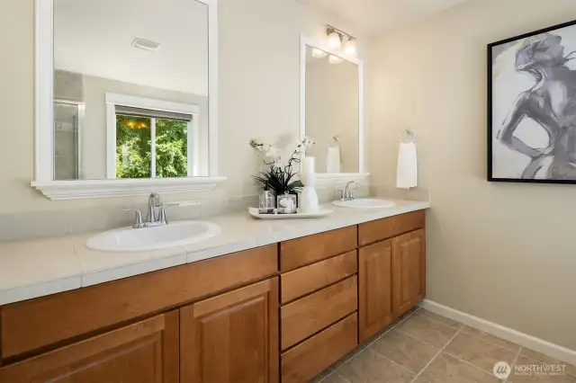 Five piece ensuite bathroom with double vanity.