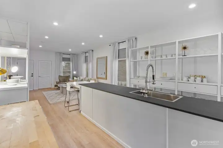 Kitchen features high-end German Poggenpohl cabinetry, stainless steel appliances; induction range, Viking refrigerator, and locally sourced, Tacoma-made Richlite countertops—durable, eco-friendly, and crafted from FSC®-certified paper and resin.