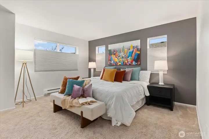 Spacious primary bedroom featuring walk-in closet and en suite bath.