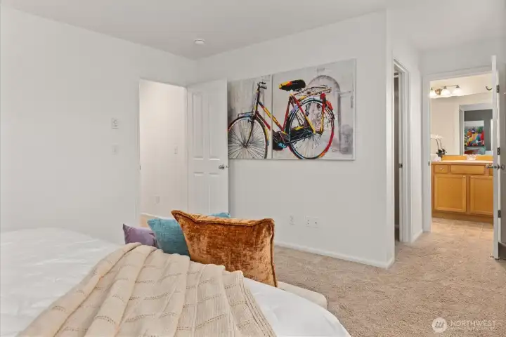 Spacious primary bedroom featuring walk-in closet and en suite bath.
