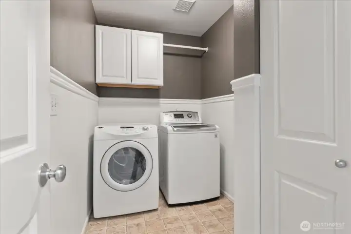 Expansive laundry with additional storage.