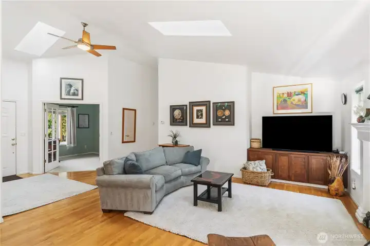 From here you can see the front door, French doors to the den, hall to the bedrooms and the Living room with skylights and ceiling fan. Oak floors.