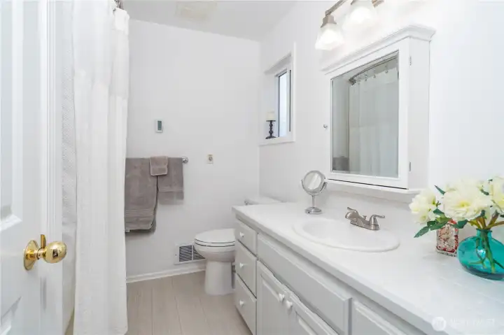 Primary bathroom is a full bath with a tub/shower.