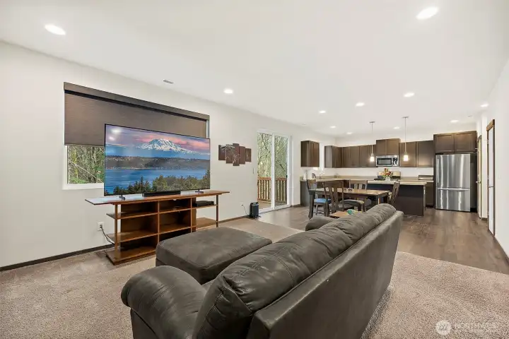 Custom window treatments throughout. The living room blind is power operated.