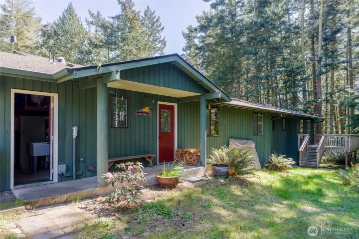 Red doors lead to garage left, house right