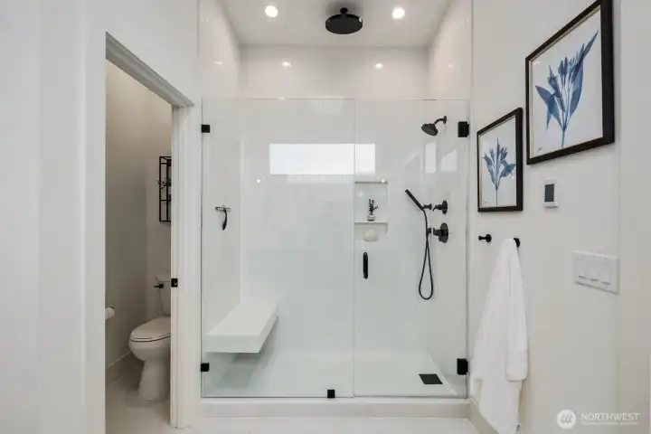 Frameless glass walk-in shower with modern finishes