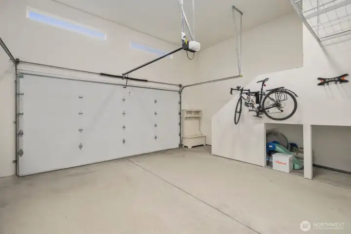 Two-car garage with EV charging and plenty of overhead storage