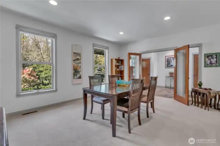 Oversized formal dining room is gorgeous and features wonderful natural lighting