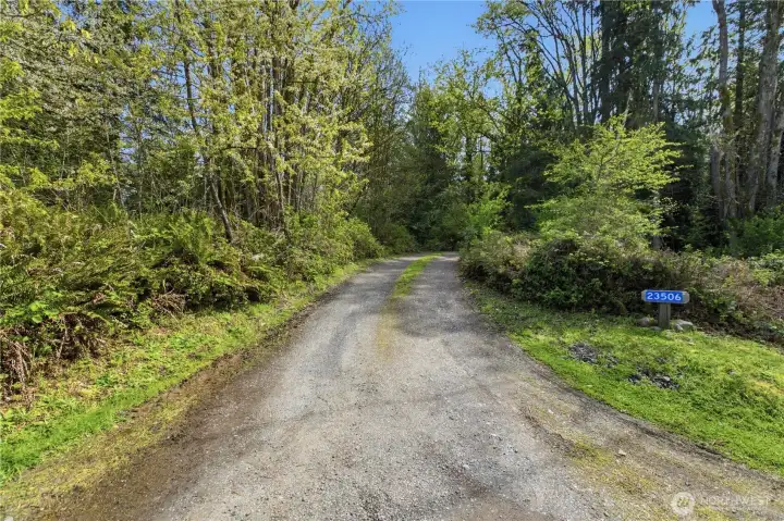 Private street entry to meandering driveway