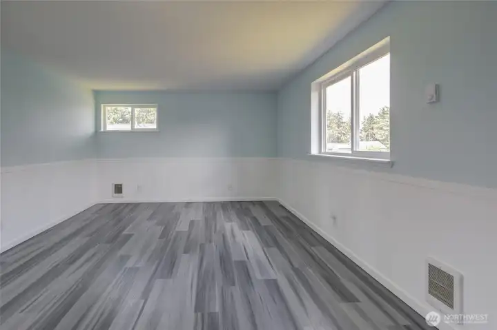 Light-filled primary bedroom with soft neutral tones, a spacious layout, and a calm, relaxing feel.