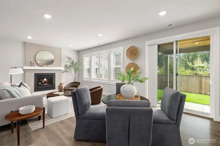 Dining area overlooking covered patio and back yard