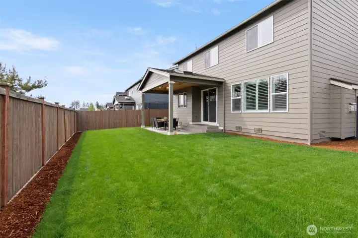 Look at that fully fenced, level yard!   Ready to enjoy!