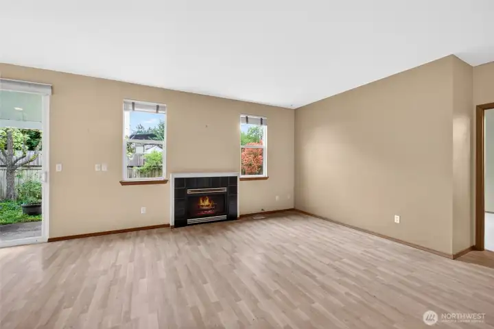 Cozy gas fireplace anchors the living space, perfect for relaxing nights or gathering with friends.