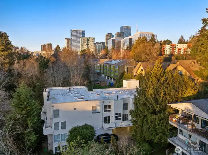 Smaller townhome-like building nestled in among the greenery
