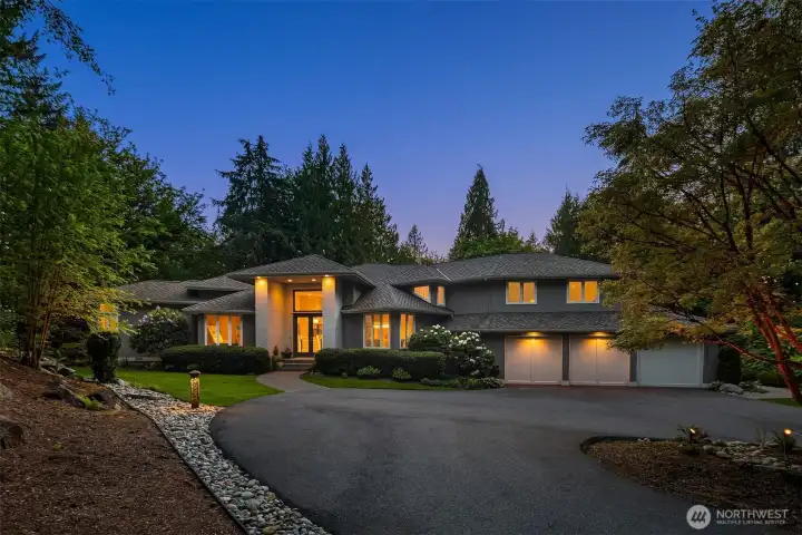 Welcome to this custom-built Ben Leland home, featuring stucco siding, meticulously landscaped grounds, and luxurious, spacious interiors designed for both comfortable living and elegant entertaining.