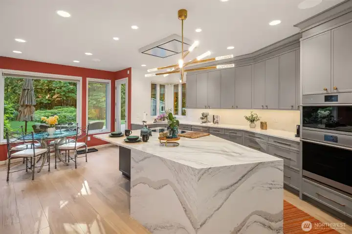 Natural light fills the space, offering ample dining area and seamless backyard access from the kitchen.