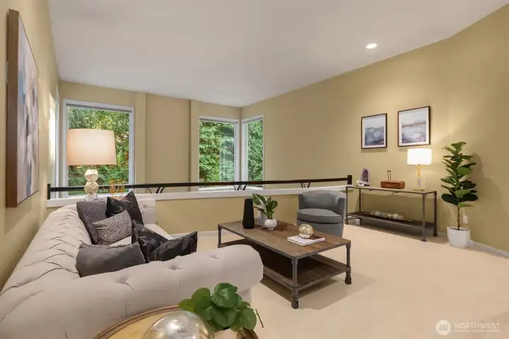 Living room featuring soaring ceilings, expansive windows, and exceptional natural light.