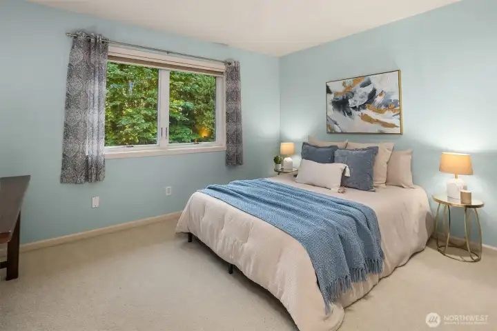 Bedroom 1 features peaceful backyard views