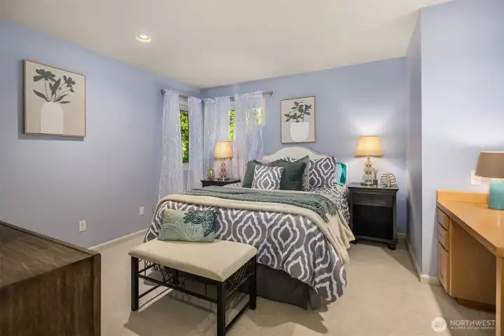 Bedroom 2 includes custom built-in desks, ideal for work or study