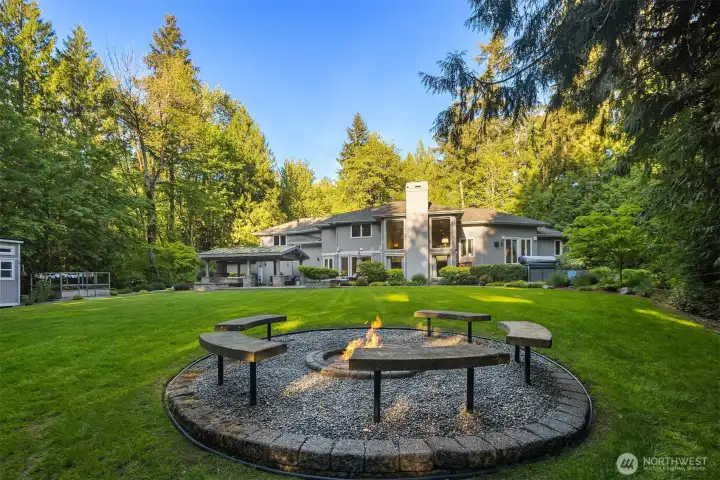 Large, flat, and beautifully landscaped backyard that backs to a serene greenbelt, offering exceptional privacy and tranquility