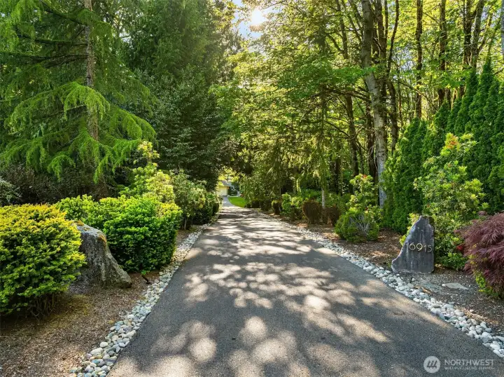 Situated on a quiet dead-end street, the home features a long circular driveway that welcomes you home in style.