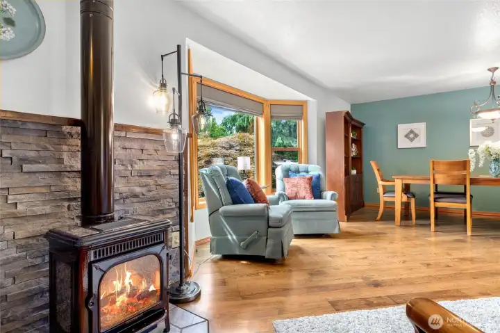 Entry way in to the living room with welcoming vibes and propane fireplace.