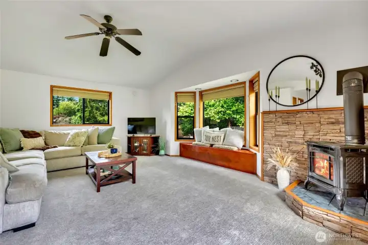 Large additional Family room with back yard access and propane fireplace.