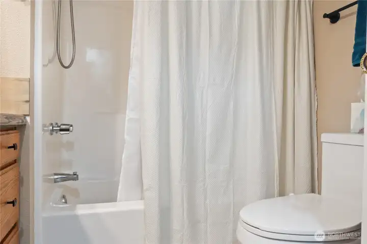Primary bath full tub/shower combo.