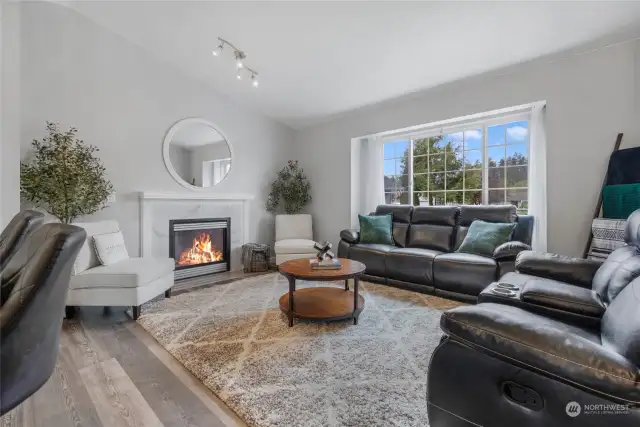 Cozy up by the fireplace in one of two living areas!