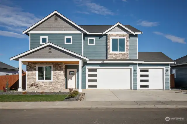 Front of home, 3 car garage