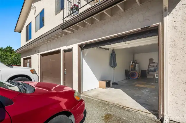 Secure two-car garage with ample space for tools.