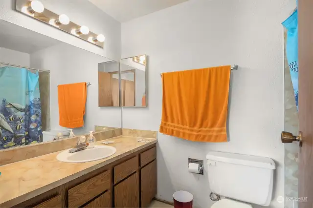 Spacious bathroom with sleek, modern finishes.