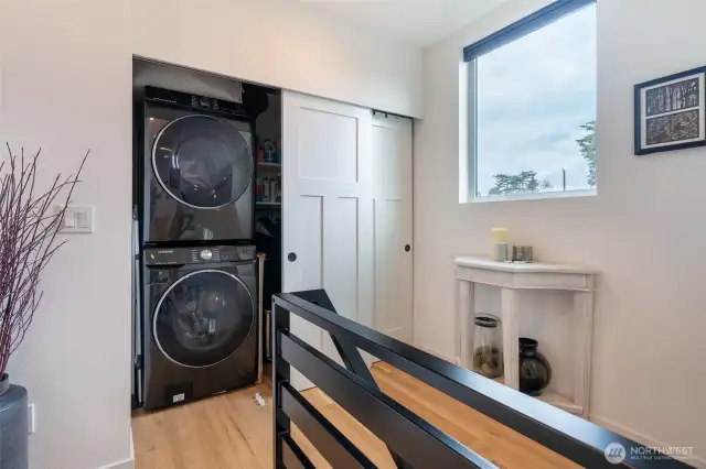 Custom California Closet next to the full size stackable washer/dryer