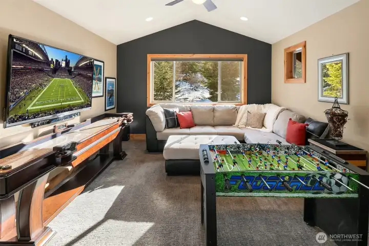Upstairs bonus room with sliding barn doors, designed as a bunk room in the original house plans.