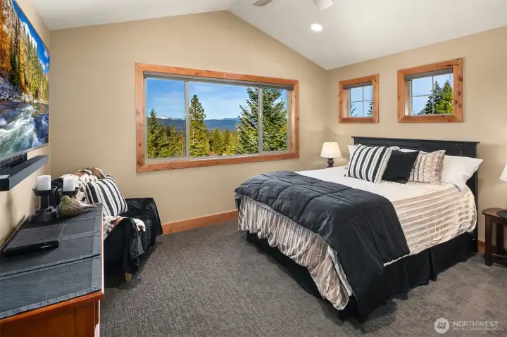 Upstairs guest bedroom with views to Peoh Point and the Stewarts.  Walk-in closet as well.