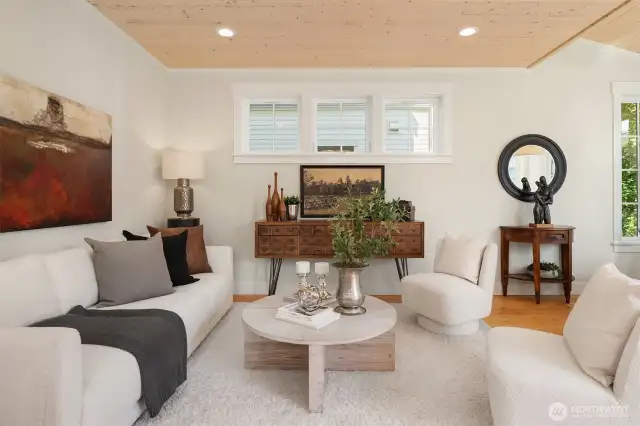The comfortable living room overlooks dining and the cook's kitchen.