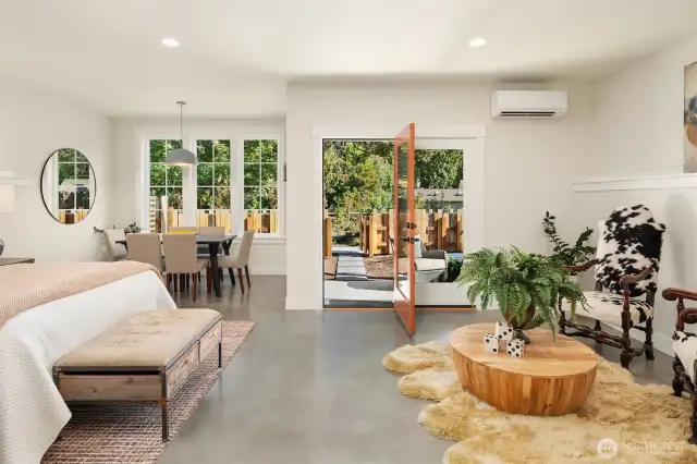 Explore the downstairs studio/flex space with polished concrete floors, wetbar and separate private entry to a patio and fenced rear yard.