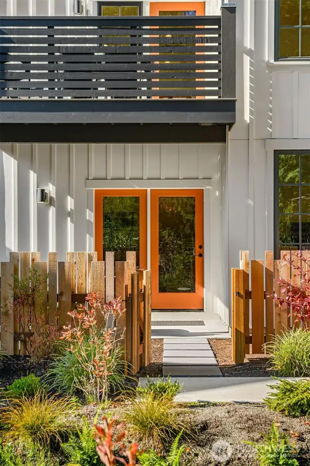 The lower level private entry features a patio and fenced rear yard/gated entry.