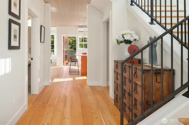 Gleaming solid wood floors grace the homes entry, living spaces and bedrooms.