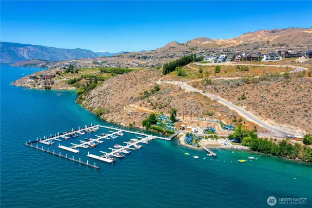 Aerial view of the Lookout's private marina and waterfront park area with sandy beach cove.