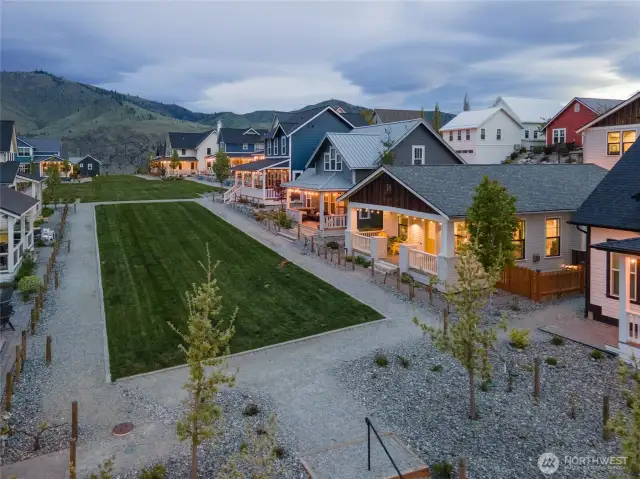Exterior aerial twilight view of home looking South along Vineyard Park.