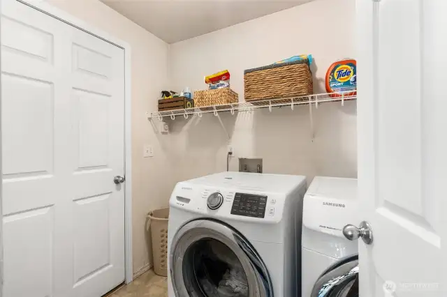 Laundry room directly off of living area. Garage beyond.