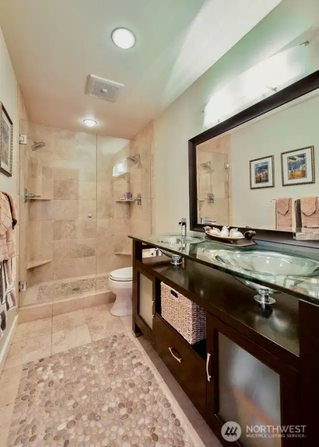 heated pebble stone and travertine floor