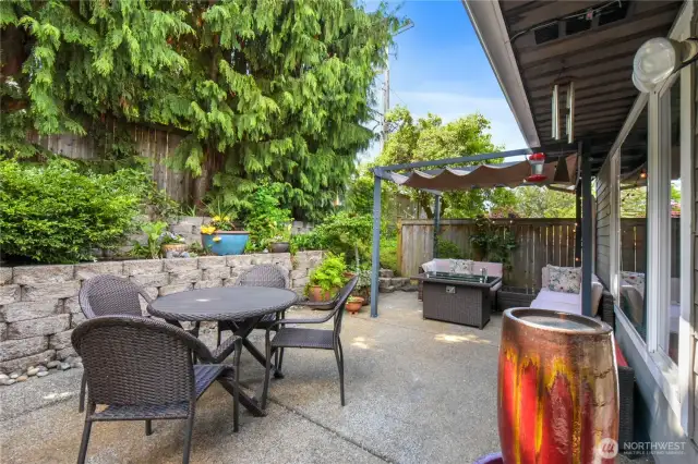 This beautifully landscaped front courtyard offers a warm and inviting
