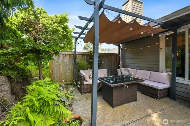 Surrounded by lush greenery and mature landscaping, the space feels private and serene.
