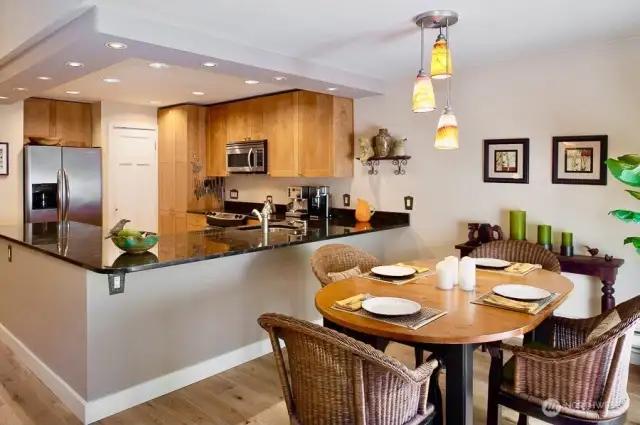 This beautifully designed open-concept kitchen and dining area creates the perfect setting for everyday living and entertaining.