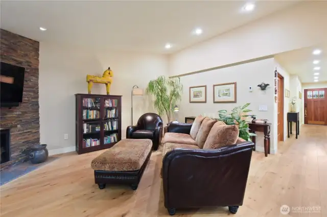 The open layout flows seamlessly from the cozy living area to the spacious dining room and into the kitchen