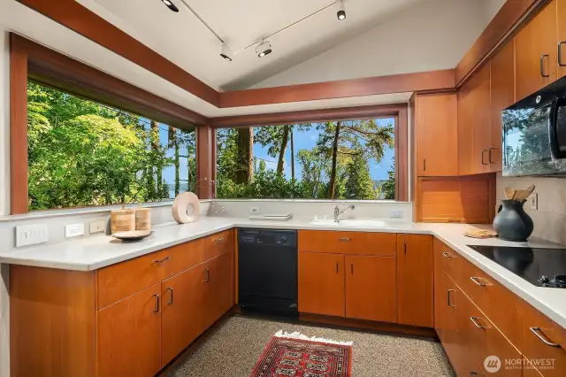 Conveniently located off the formal living area, the kitchen features generous storage and a spacious walk-in pantry for effortless organization.